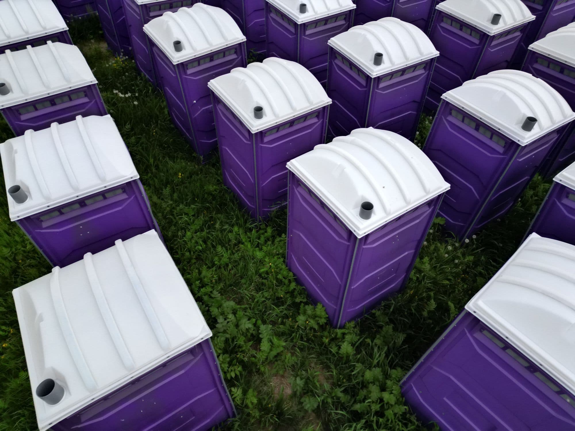 Aerial view of portable restrooms at a public event